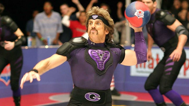 Ben Stiller in a professional dodgeball tournament throwing a ball. He has a terrible mustache. 