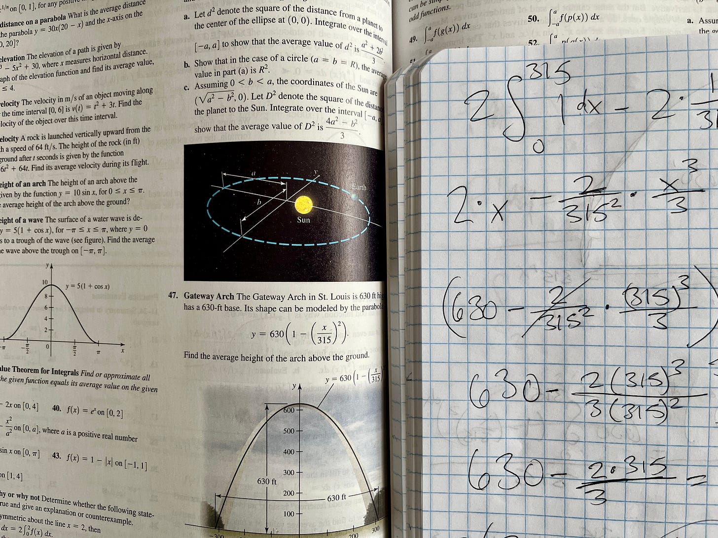 Calculus book and notebook with equations