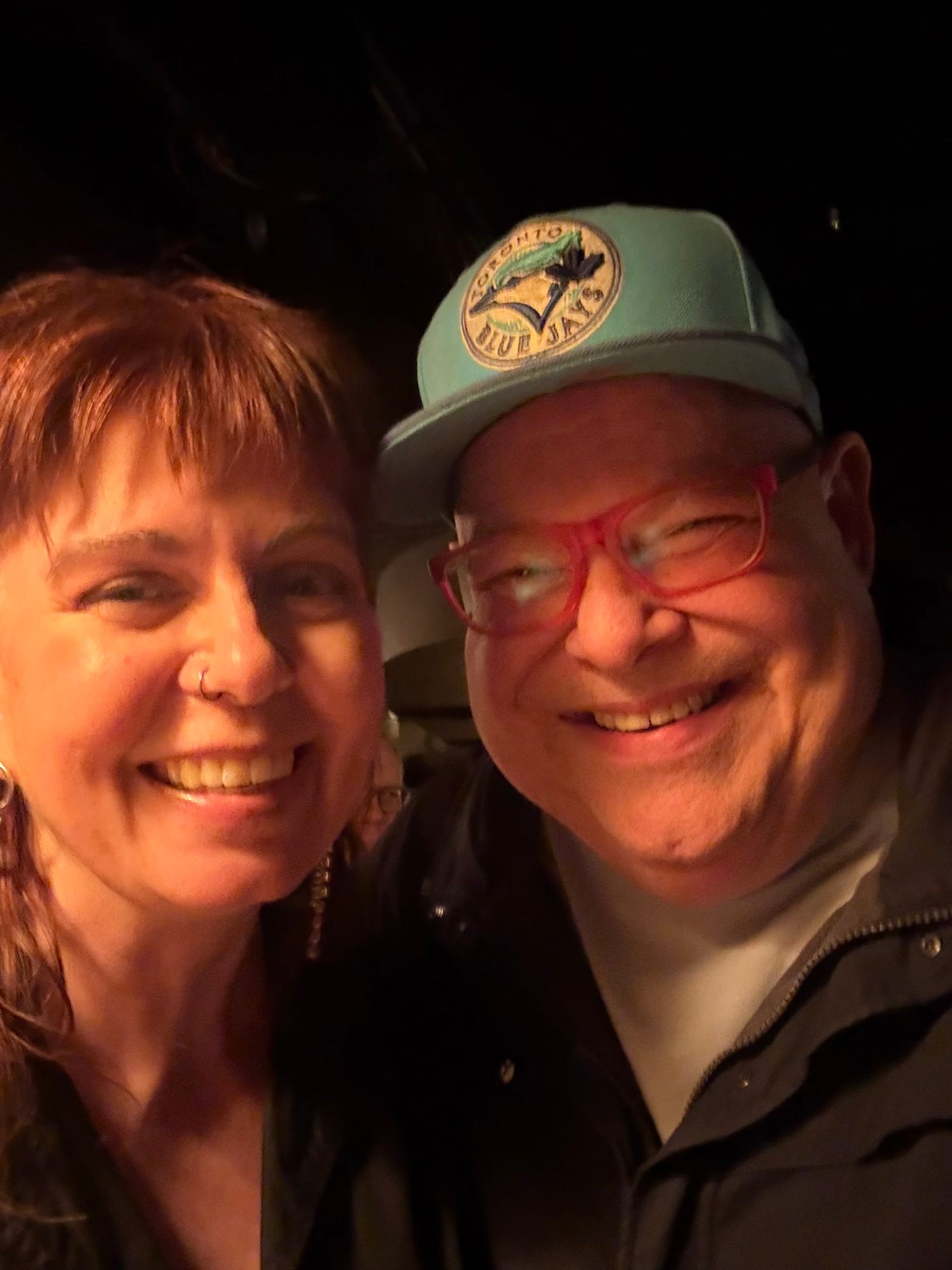 Smiling poets Jennifer LoveGrove and Kirby take a selfie.