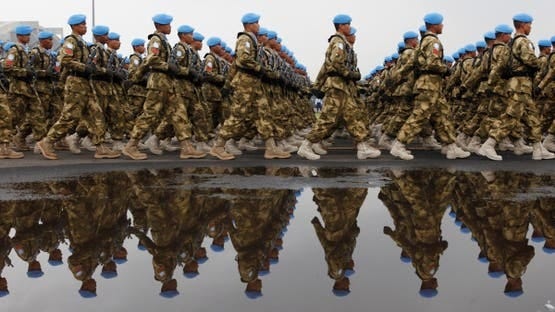 Indonesia's UN peacekeeping force personnel march during a ceremony to commemorate the 65th military anniversary at a base in Jakarta, October 5, 2010. (Reuters)