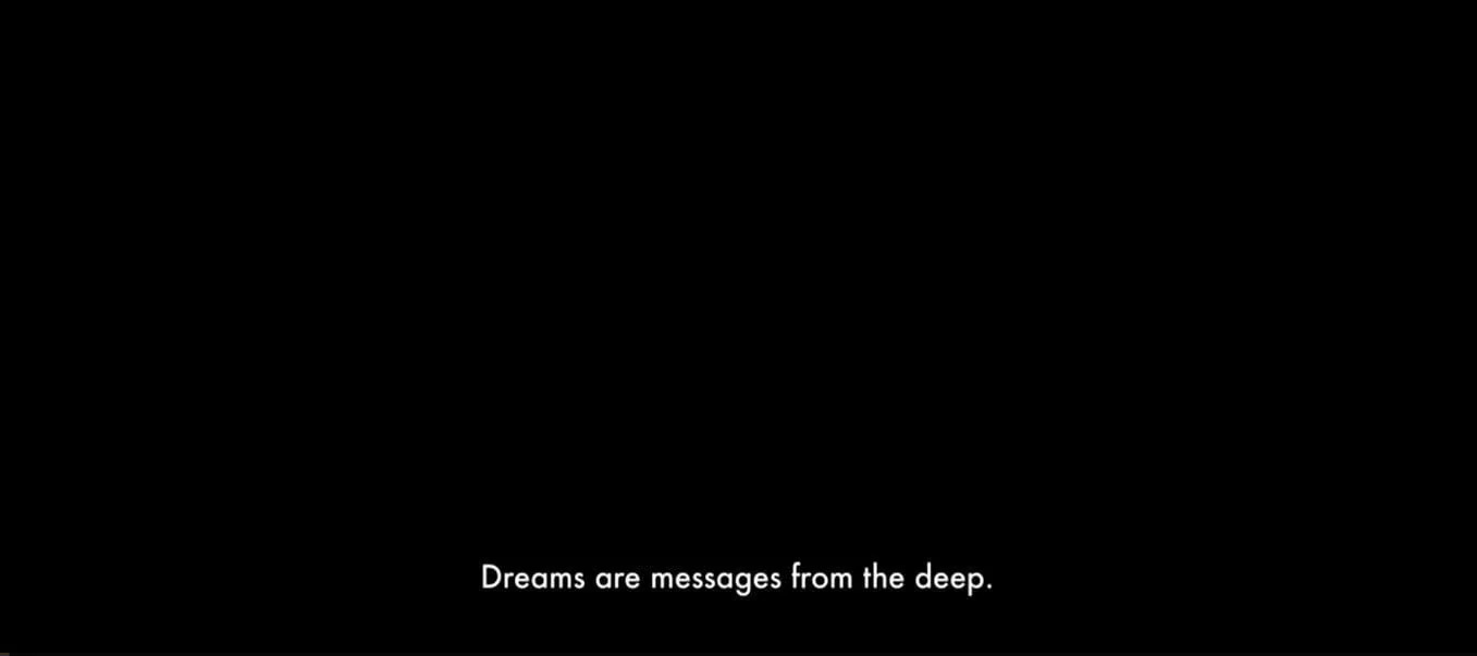 A minimalist still from the opening of Dune (2021) featuring the phrase “Dreams are messages from the deep” in white subtitles on a black background. This iconic line sets the tone for the film’s exploration of prophecy and power, and serves as the thematic seed for this essay on dreaming, collapse, and resistance.