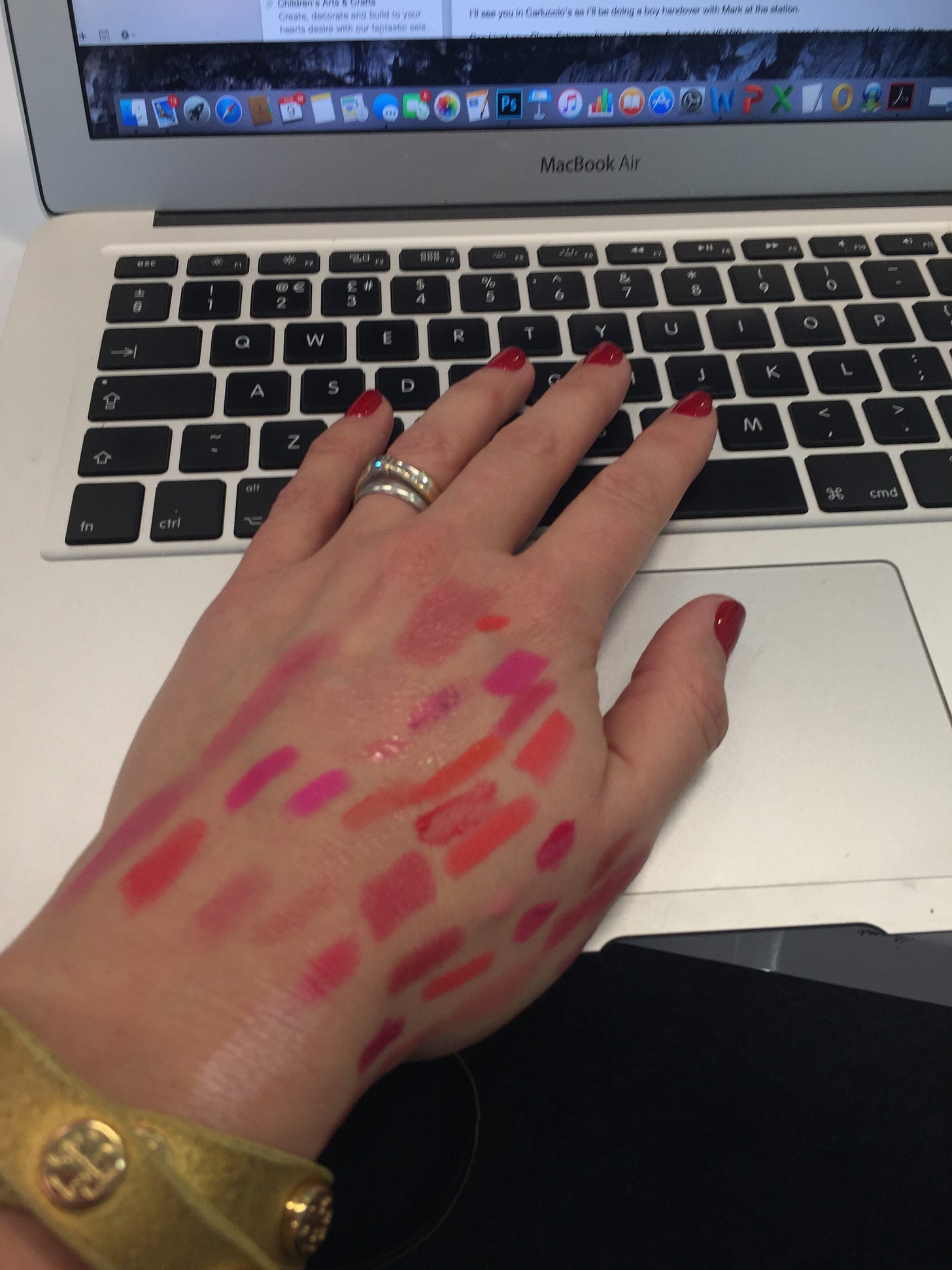 A picture of The Beauty Ed® Donna Francis' hand at her keyboard