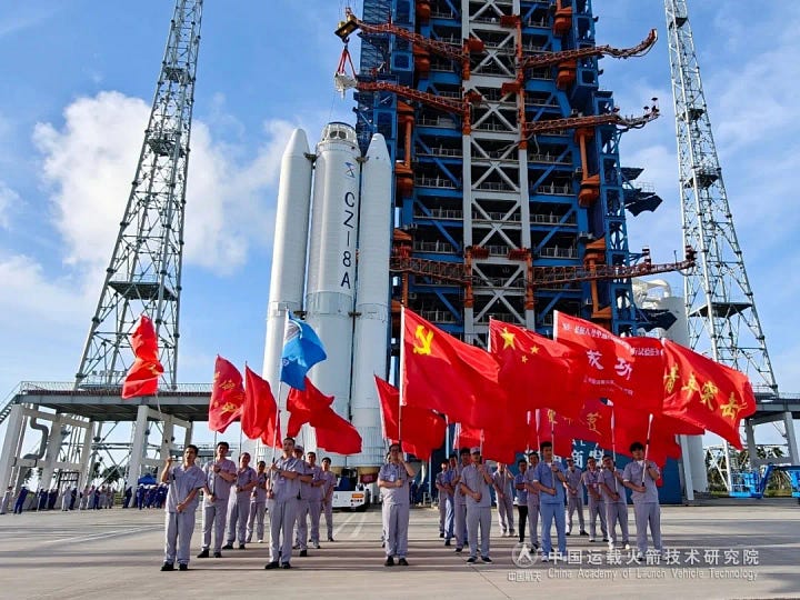 Hardware for the Long March 8A Y4 vehicle heading to the launch pad and during processing.