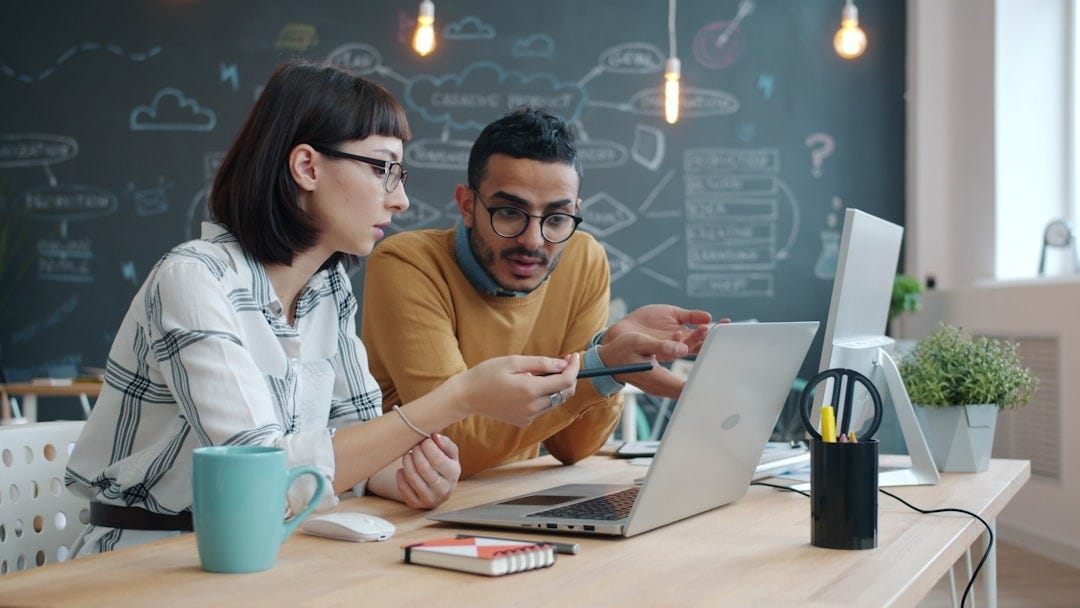 Two colleagues collaborating on a laptop at a desk. Photo by Vitaly Gariev on Unsplash Two colleagues collaborating on a laptop at a desk. Photo by Vitaly Gariev on Unsplash