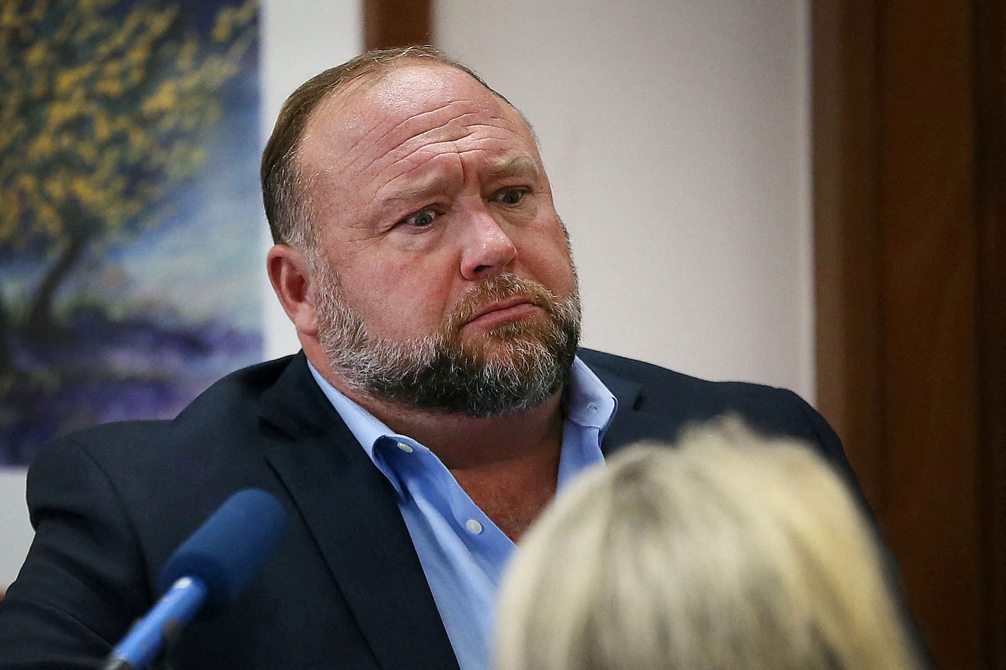 Alex Jones appears in Austin district court.