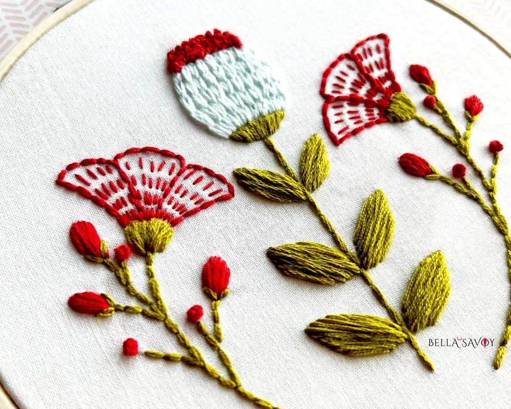 close up of 5 basic embroidery stitches used on a flower pattern