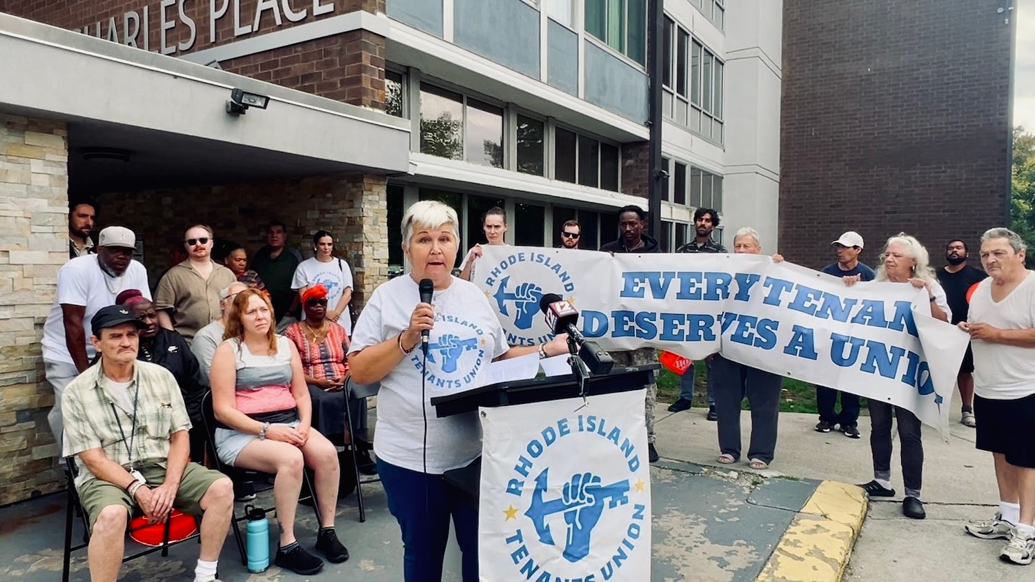 Tenants rally outside Charles Place Apartments to demand landlord ...