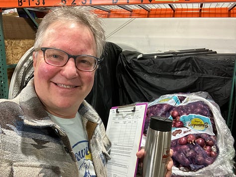 Kacey is wearing a hat and glasses by a river, holding his books by a bookstore, and holding a clipboard at the food distribution center