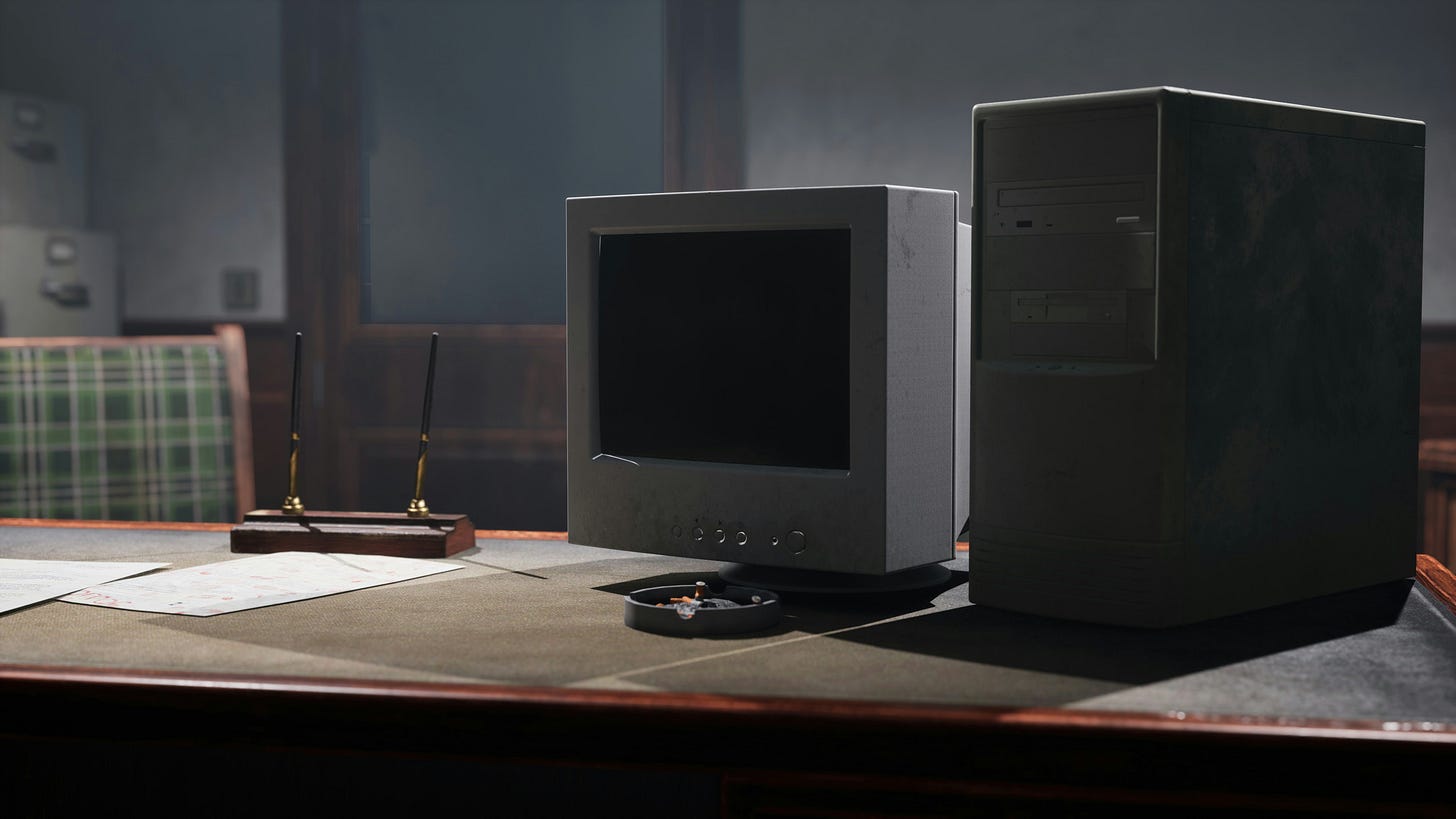 A computer monitor and a tower sits on a desk with two pens. 