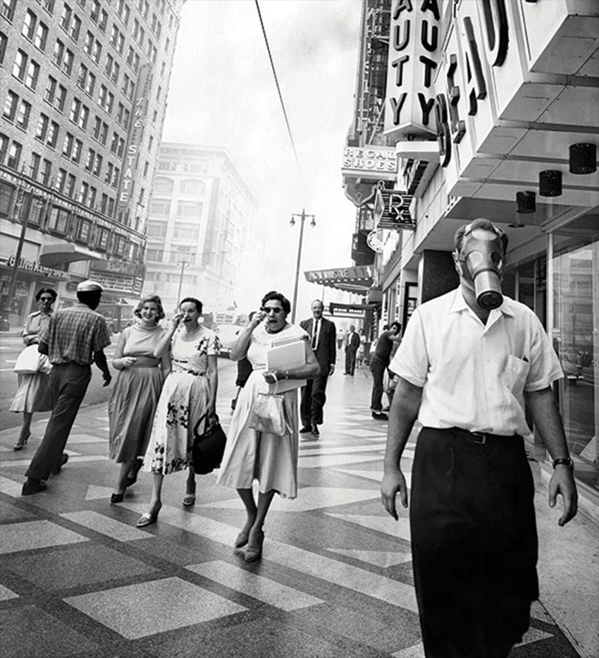 Man walking in 1940s Los Angeles wearing gas mask Man walking in 1940s Los Angeles wearing gas mask