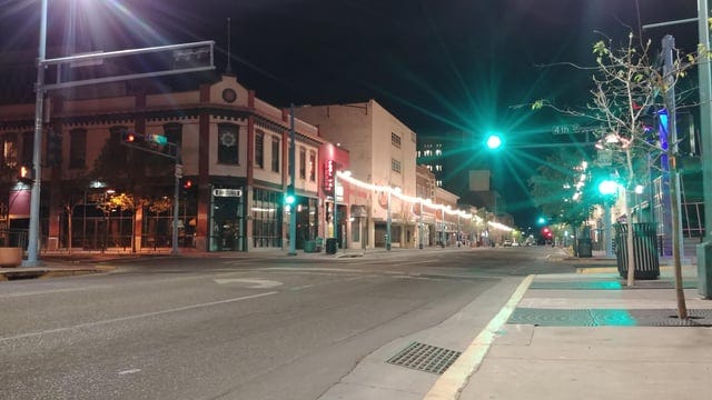 r/Albuquerque - a street with buildings and lights at night