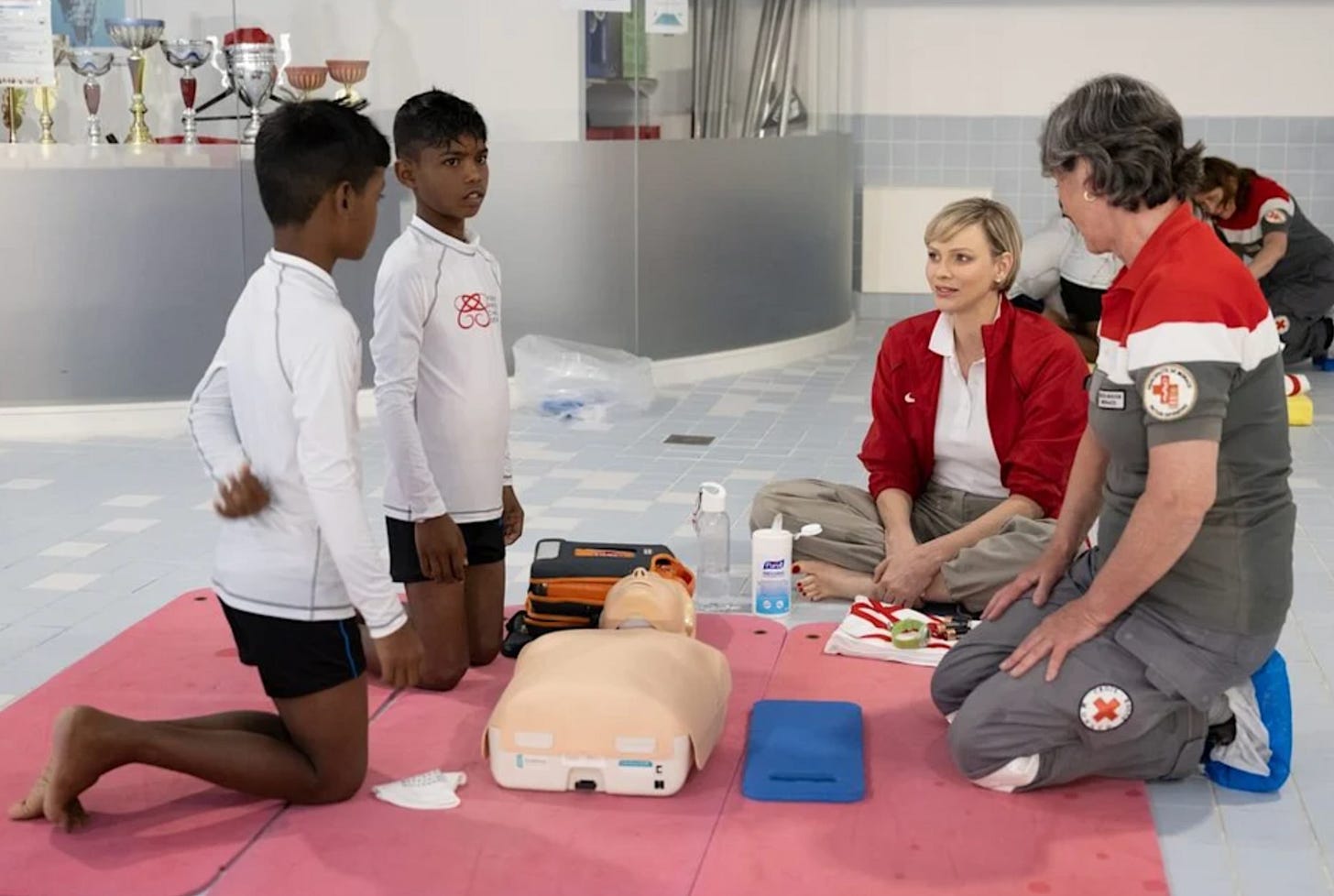 Princess Charlene teaching first aid with young children Princess Charlene teaching first aid with young children