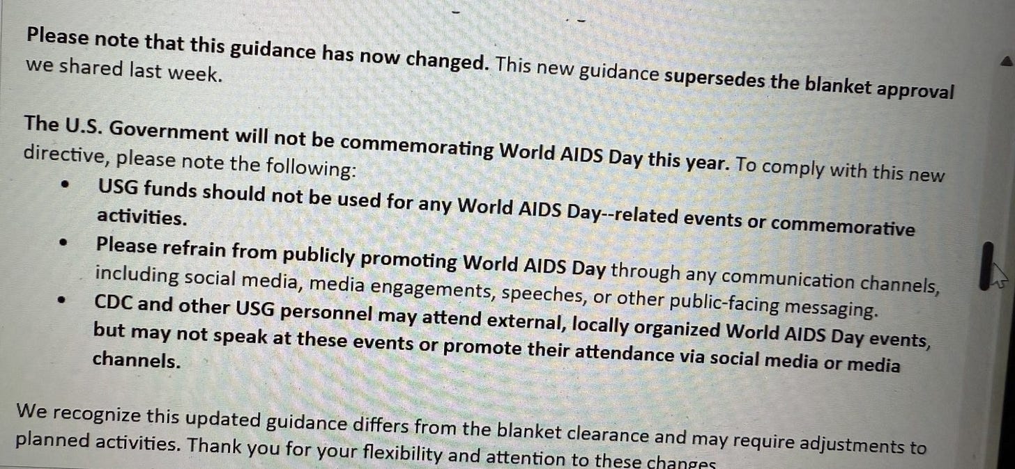Photograph of a printed guidance memo stating that the U.S. Government will not be commemorating World AIDS Day this year. Key points include: USG funds should not be used for related events, personnel should refrain from public promotion via social media or other channels, and CDC and other USG staff may attend local events but cannot speak or promote attendance. The memo notes this guidance supersedes previous blanket approval and may require adjustments to planned activities.