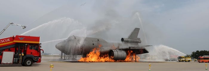 Firefighters are extinguishing a plane fire at the 'Ready Korea' training held at Incheon International Airport on the 5th. The training was conducted on the assumption that the plane left the runway while landing and collided with a bus, causing a number of casualties. [Reporter Han Joo-hyung]