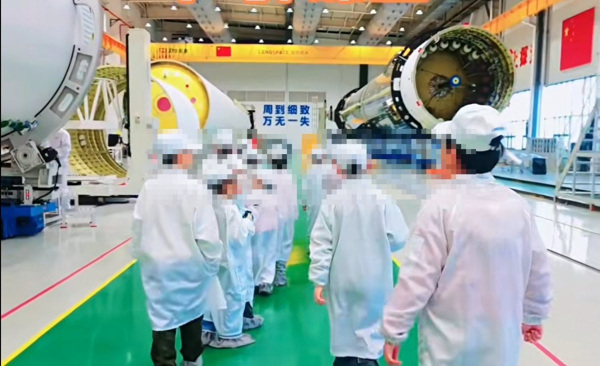 A Zhuque-3 launch vehicle undergoing assembly in LandSpace’s assembly facility during an educational tour in December 2025. A Zhuque-3 launch vehicle undergoing assembly in LandSpace’s assembly facility during an educational tour in December 2025.