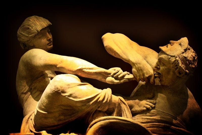 A statue of a person and person

Description automatically generated