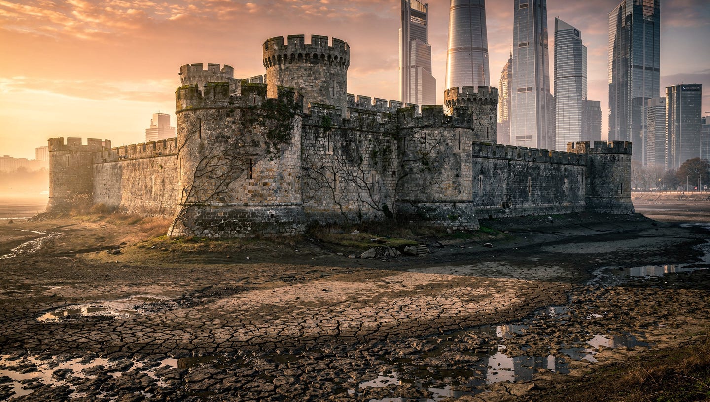 A hyper-realistic, cinematic wide shot of a majestic medieval stone fortress. The deep moat surrounding it is rapidly drying up, revealing cracked, parched earth and mud. On the horizon, modern high-tech skyscrapers are rising, casting long shadows over the old castle. Dramatic sunset lighting, 8k resolution, highly detailed textures of stone and dry ground, professional photography style.