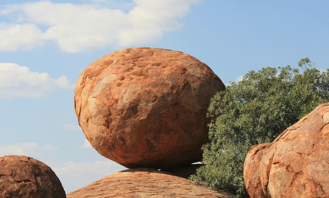 brown rock formation under blue sky during daytime