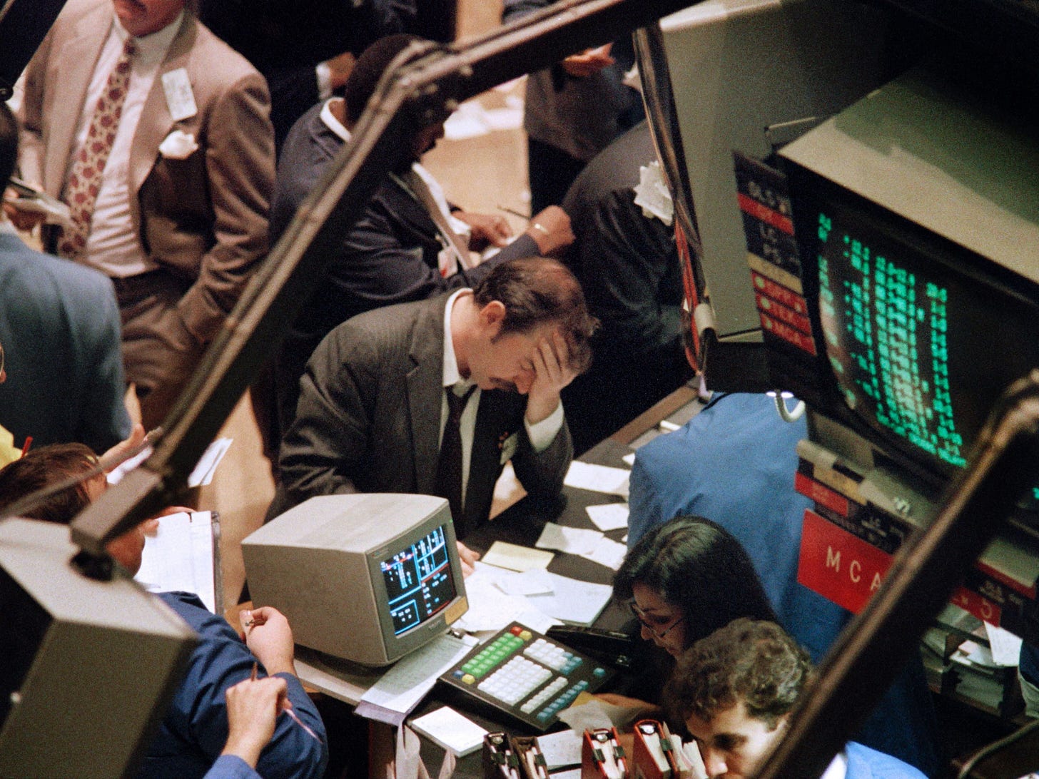 Black Monday had many negative's, but it gave us a new cultural touchstone: Stock Exchange photos of depressed traders.
