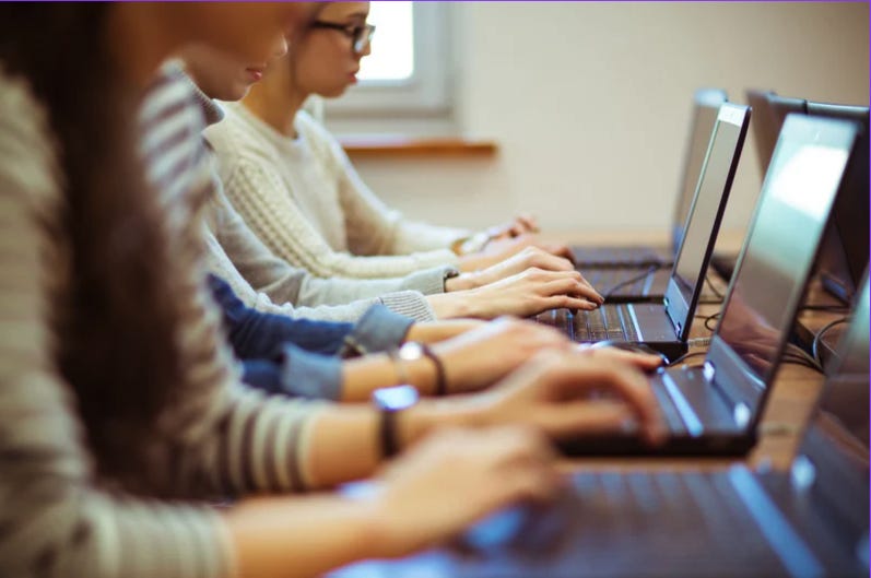 A group of people using laptops

AI-generated content may be incorrect.