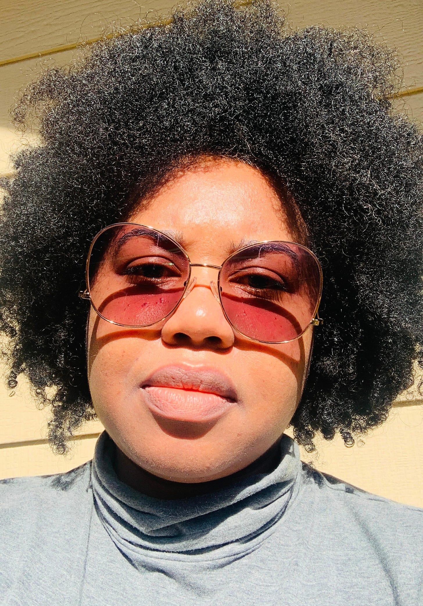 me, in shades, with my tiny fro