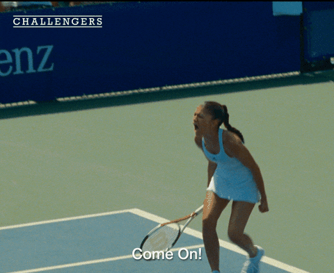 A younger Tashi Duncan screams "come on!" while competing in a tennis match.