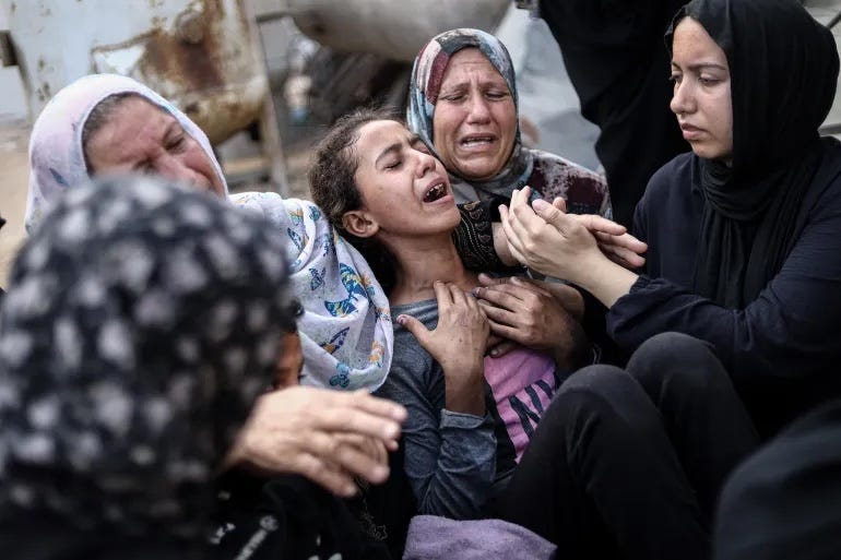 As the genocide grinds on, Palestinians mourn their loved ones at al-Shifa Hospital in Gaza City.