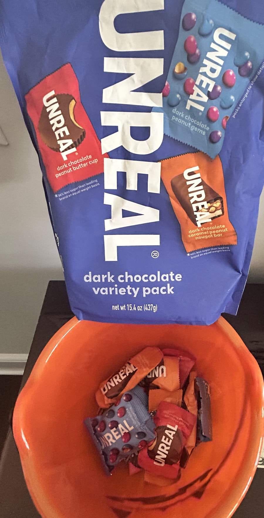 A trick-or-treat bowl on a counter filled with UNREAL candy A trick-or-treat bowl on a counter filled with UNREAL candy