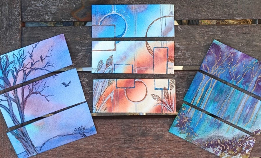 three pieces of watercolour art by Kel, showing a winter tree with a bird, geometric shapes on a blue and orange background, and an ethereal forest