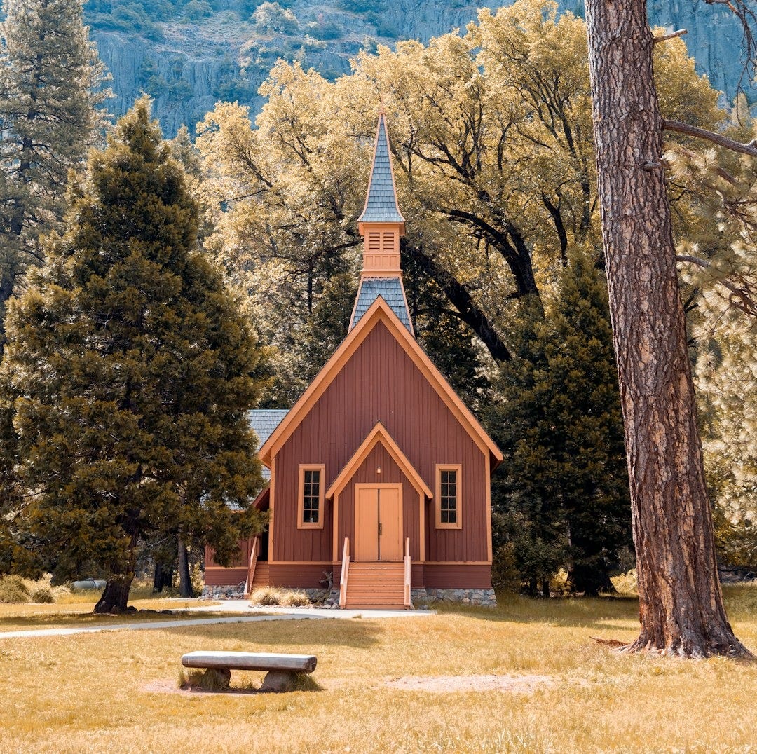 brown wooden house beside green trees near mountains during daytime brown wooden house beside green trees near mountains during daytime