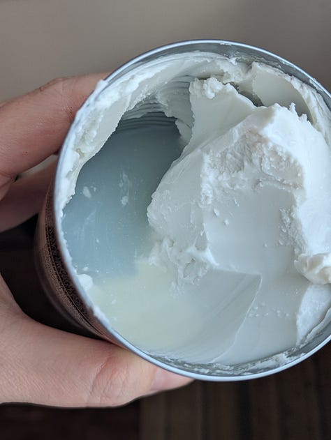 Fresh thai basil used as optional but tasty garnish. Coconut cream can with expected separation. Rice toasting in coconut cream.