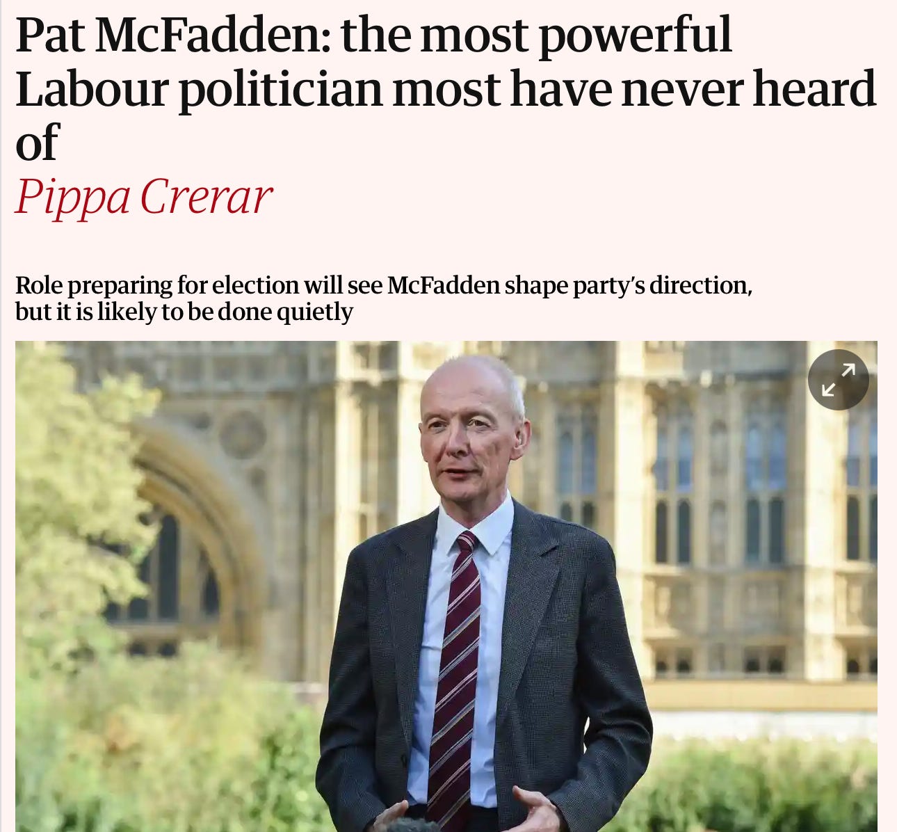 A person in a suit and tie

Description automatically generated