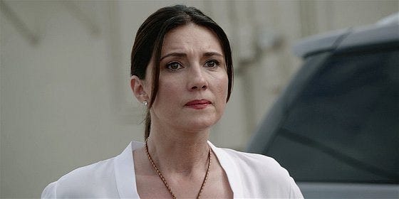 Walker Mickis mother looking dour. Walker Mickis mother looking dour.