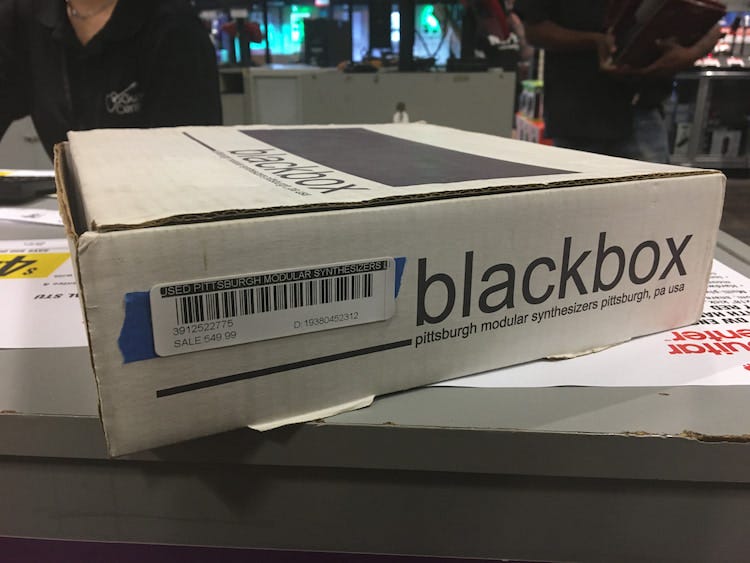 Photo of a box on a retail store counter.
