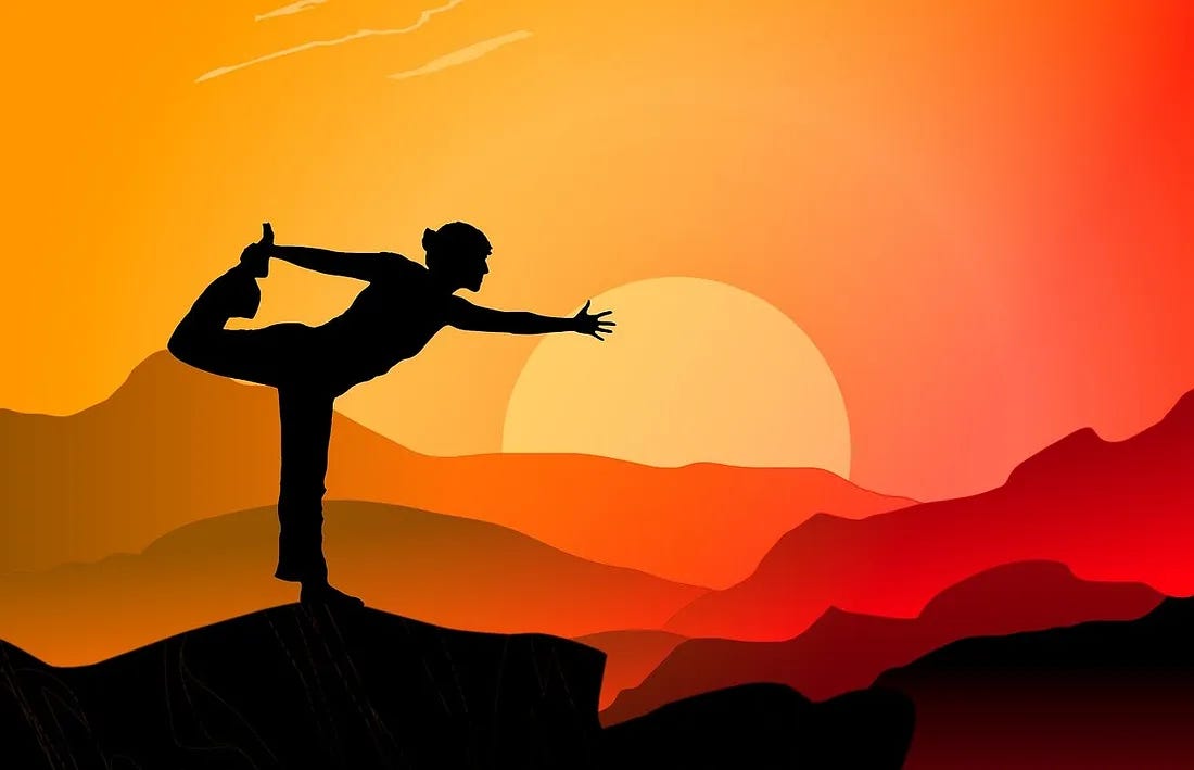 silhouette of woman in yoga pose on a mountain against a bright sunrise (define your audience) silhouette of woman in yoga pose on a mountain against a bright sunrise (define your audience)