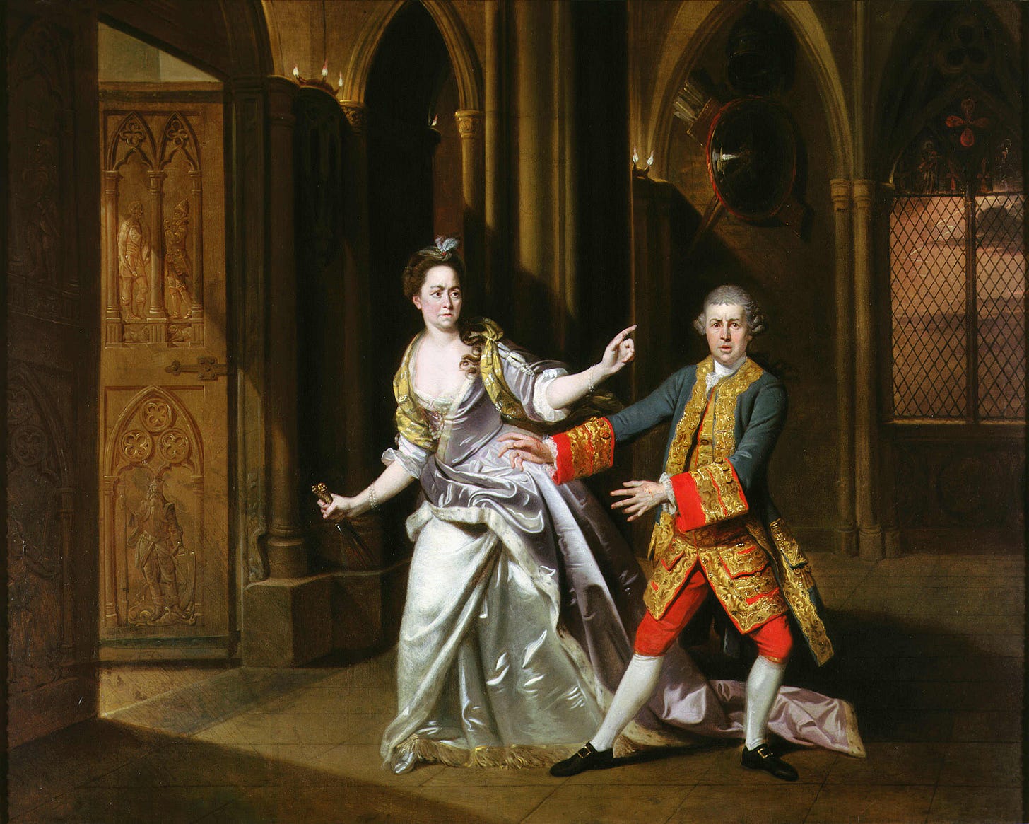 In a Gothic hall, a woman in a wide silver silk gown holds a dagger in one hand and points away with the other, while a man in a gold-embroidered coat and red breeches steps back with his empty hands spread. In a Gothic hall, a woman in a wide silver silk gown holds a dagger in one hand and points away with the other, while a man in a gold-embroidered coat and red breeches steps back with his empty hands spread.