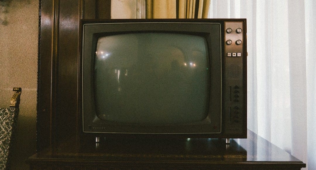 turned-off gray CRT TV on table turned-off gray CRT TV on table