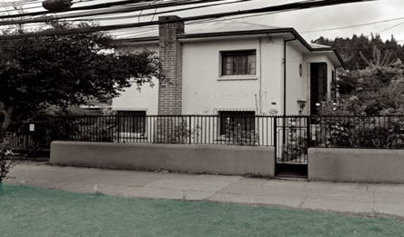 A house with a fence

Description automatically generated