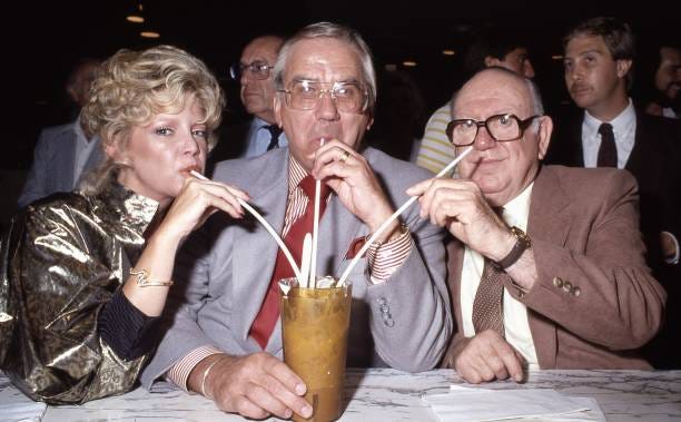 Personality Ed McMahon with his wife Victoria and Leon Schwab owner of Schwab's Pharmacy share a milkshake at the 50th anniversary of the famous...
