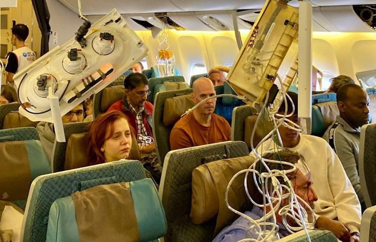 a group of people sitting on an airplane