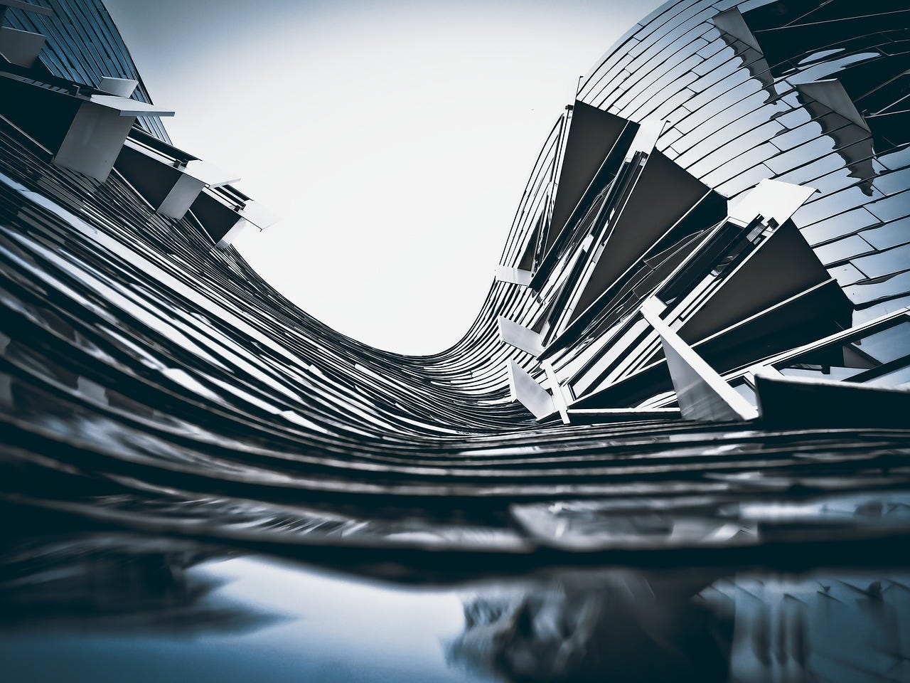 Collapsing gray-colored apartment building as an analogy for the essay's title of how AI infrastructure investment enables enterprises to skip human systems Collapsing gray-colored apartment building as an analogy for the essay's title of how AI infrastructure investment enables enterprises to skip human systems