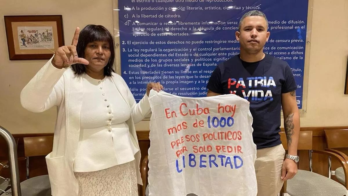 A person and person holding a sign

AI-generated content may be incorrect.