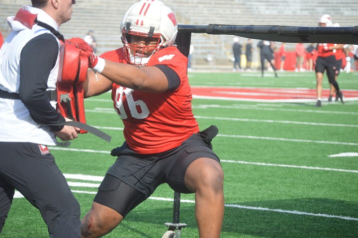 Wisconsin defensive linemen participate in individual position drills during Saturday's spring practice inside Camp Randall Stadium.