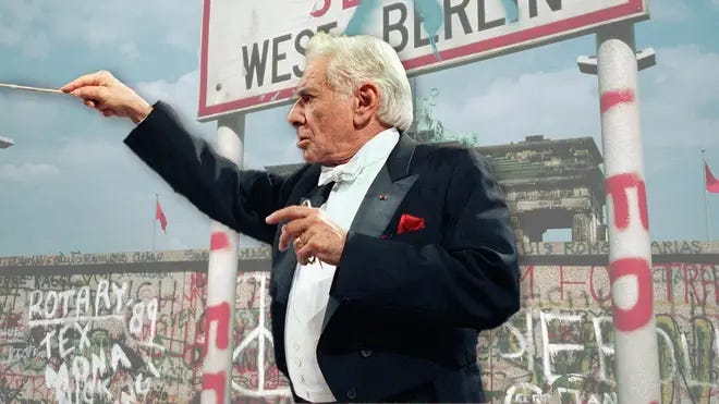 Leonard Bernstein conducting, superimposed over a background of the Berlin Wall