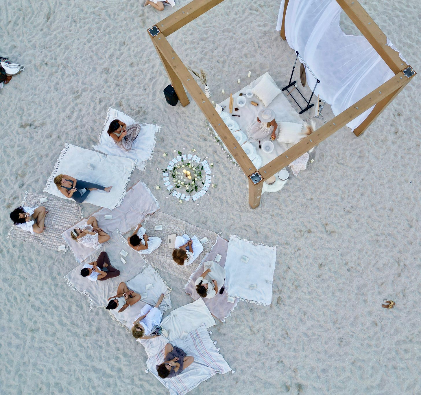 aerial shot of a sound bath meditation on the beach in Miami Beach