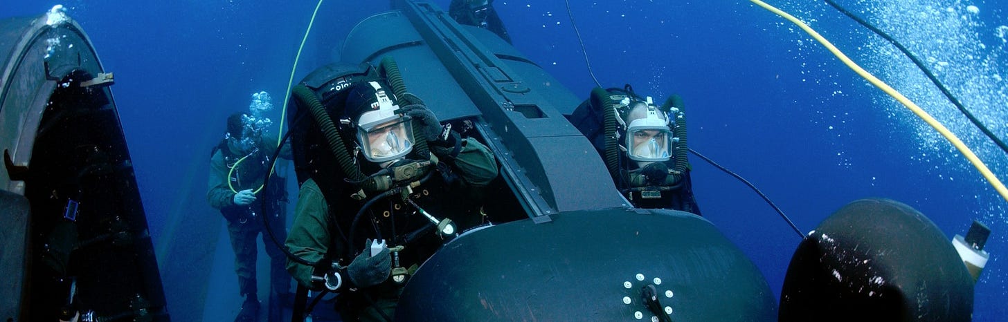 The U.S. Navy sees a future in which uncrewed underwater vehicles (UUV) work together with submersibles loaded with SEALs. The U.S. Navy sees a future in which uncrewed underwater vehicles (UUV) work together with submersibles loaded with SEALs.