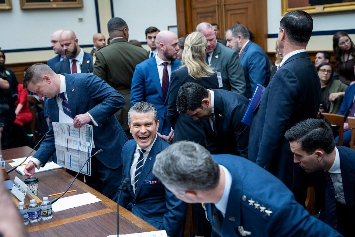 Defense Secretary Pete Hegseth talking with General Dan Caine