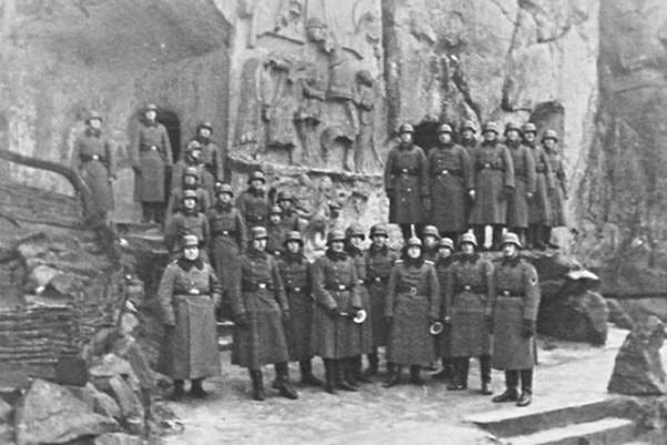A group of soldiers standing in front of a stone wall
AI-generated content may be incorrect. A group of soldiers standing in front of a stone wall
AI-generated content may be incorrect.