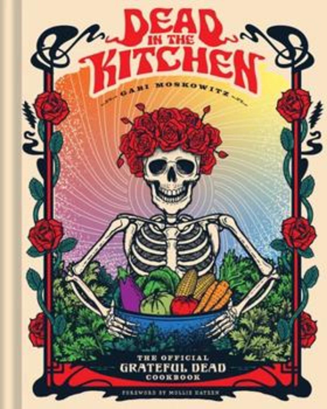 May include: A cookbook cover with the title "Dead in the Kitchen" in red, featuring a skeleton with a floral crown holding a bowl of vegetables. The cover includes the text "The Official Grateful Dead Cookbook".