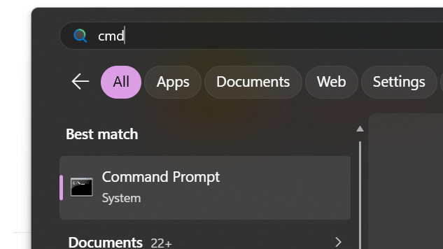 ALT text: Windows search bar with "cmd" typed. The best match result shows "Command Prompt" listed as a System application.